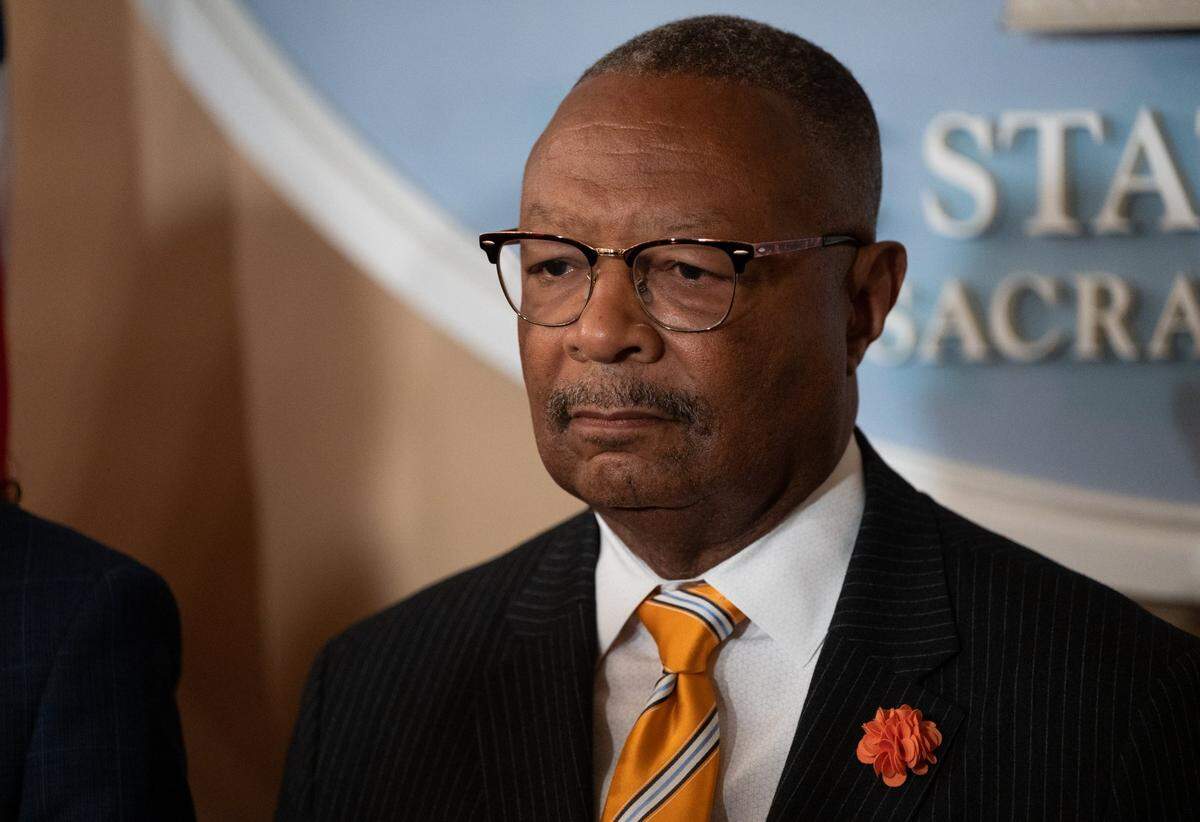Assemblymember Reggie Byron Jones-Sawyer, D-Los Angeles, listens to Tennessee state Rep. Justin Jones, at a press conference in Sacramento in May. Republicans have been attacking Jones-Sawyer, who serves as chair of the Assembly Public Safety Committee, for his stance on fentanyl bills.