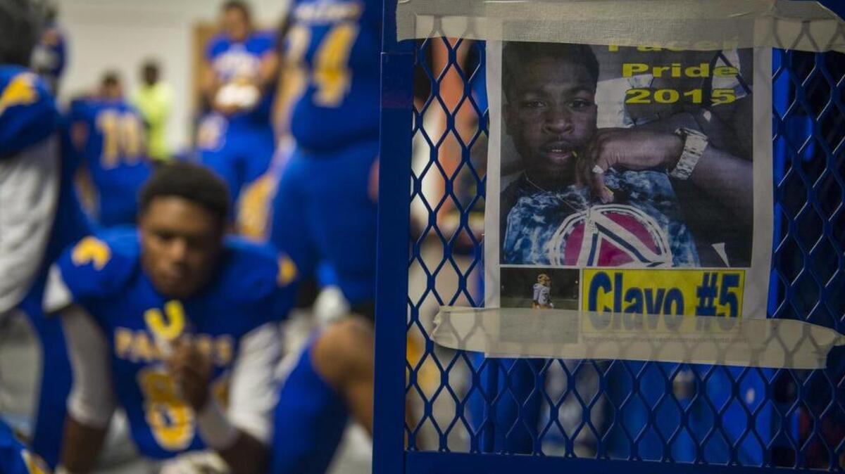 Jaulon “JJ” Clavo was remembered with a poster at a game between Grant High School and Granite Bay High School in November.
