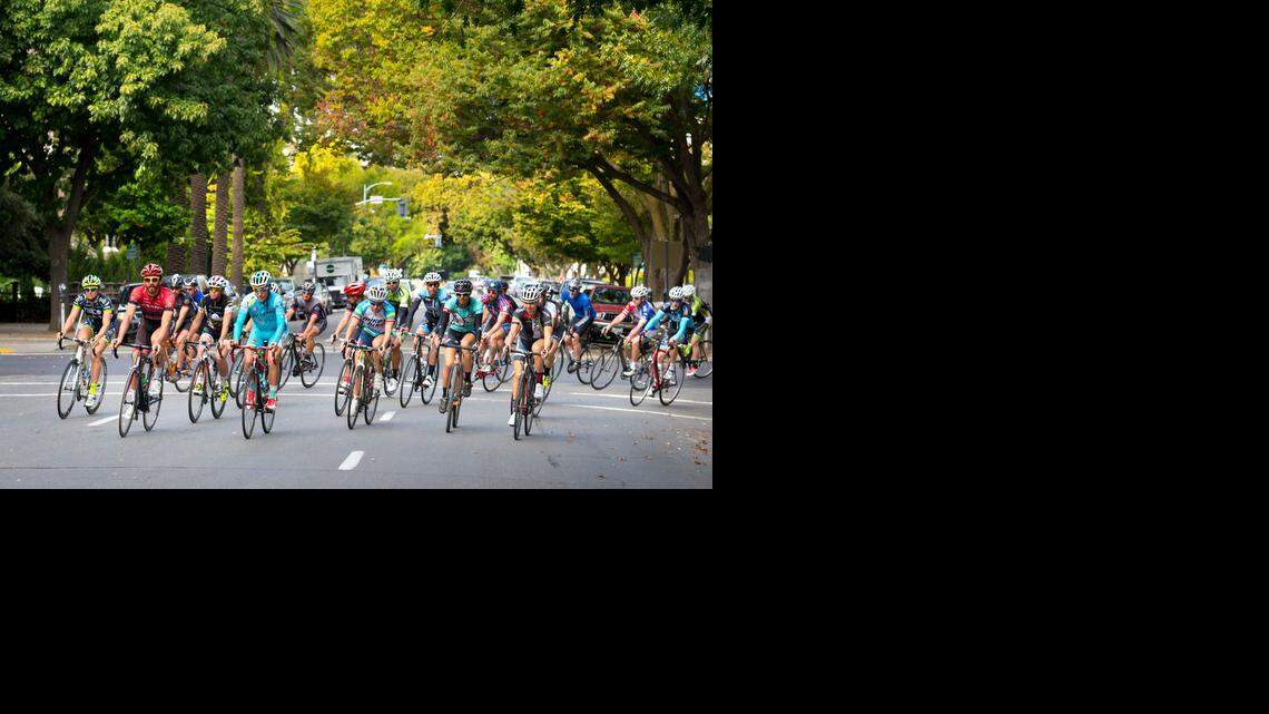 
Professional bike racers and bike enthusiasts head down N Street as they lap the Capitol before finishing on the west steps, where they take part in a press conference announcing Sacramento as host city for the opening day of the 2015 Amgen Tour of California bicycle race on Monday in Sacramento. The weeklong race, now in its 10th year, is put on by AEG and annually attracts many of the top riders and top racing teams in the world.
