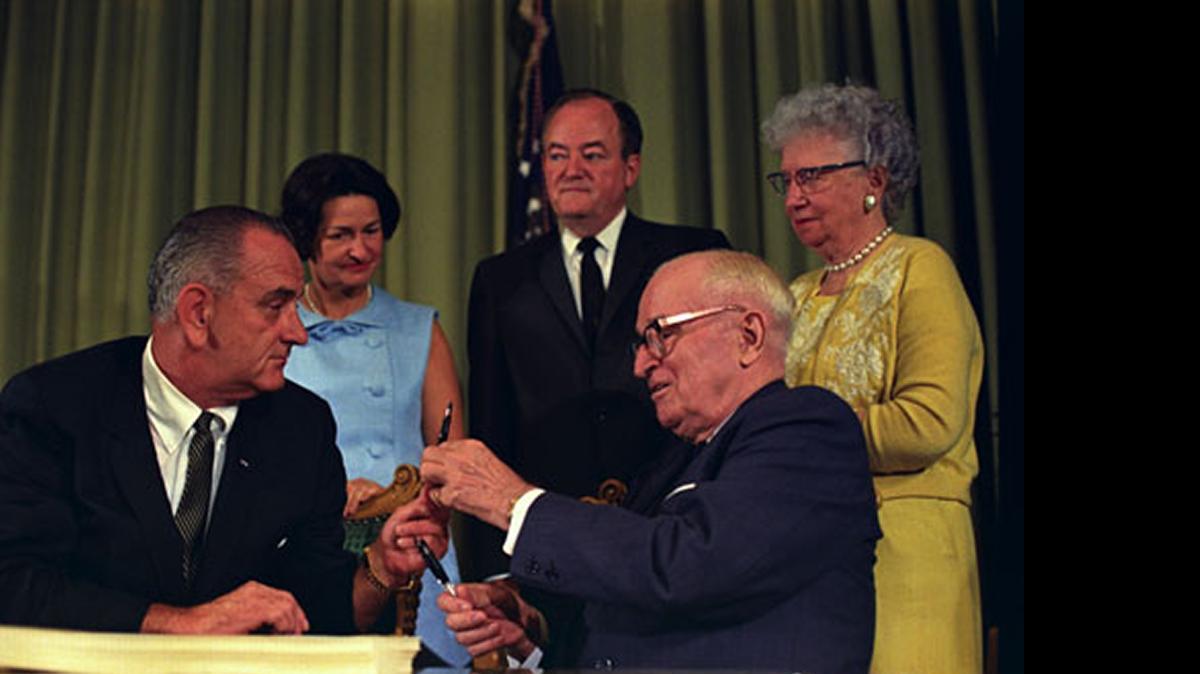 
Then-president Lyndon B. Johnson trades pens with former president Harry S. Truman on July 30, 1965, when LBJ signed historic healthcare legislation creating Medicare and Medicaid. Truman had first suggested a healthcare system about 20 years earlier.
