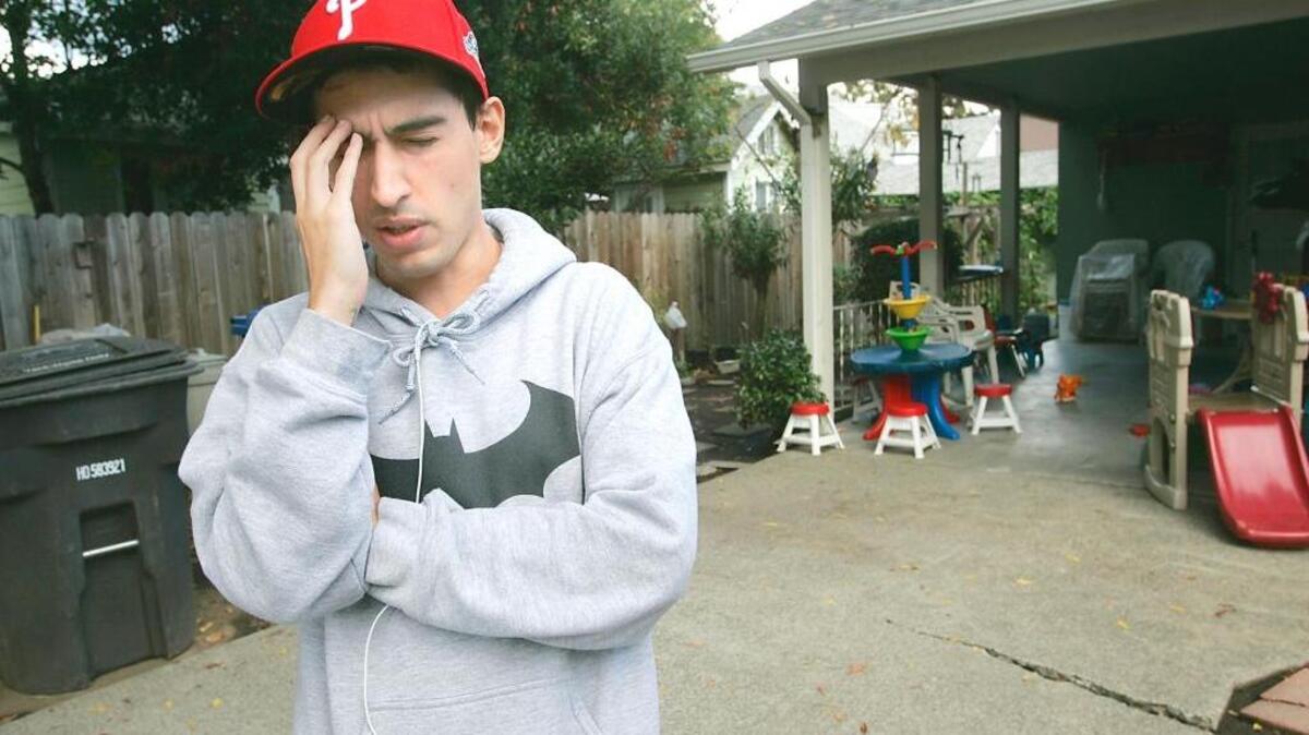 In a Nov. 2, 2015 photo, college student Luis Ortiz pauses while describing the night he ended up in the Queen of the Valley Medical Center earlier this year. Ortiz says he went to the emergency room in early September with a terrible headache and nausea, became comatose and when he woke up doctors told him he had a tapeworm larvae living in his brain and required immediate surgery. The surgery and the aftermath have greatly impacted his life, said Ortiz.