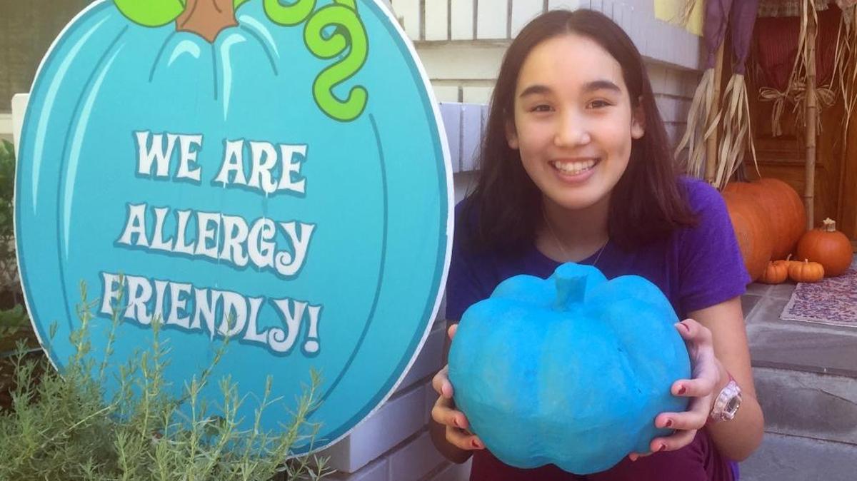 Caroline Sorrells, 12, has severe nut allergies. Teal pump kins signify a house that gives out allergy-safe treats.