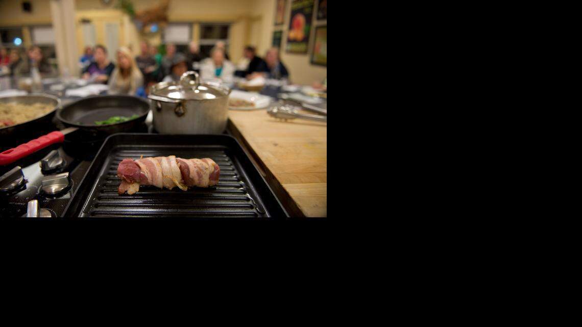 
Bacon-wrapped duck breast was among the foods that chef Dionisio Esperas cooked at “Better with Bacon” on Tuesday at the Sacramento Natural Food Co-op in honor of Bacon Fest. 
