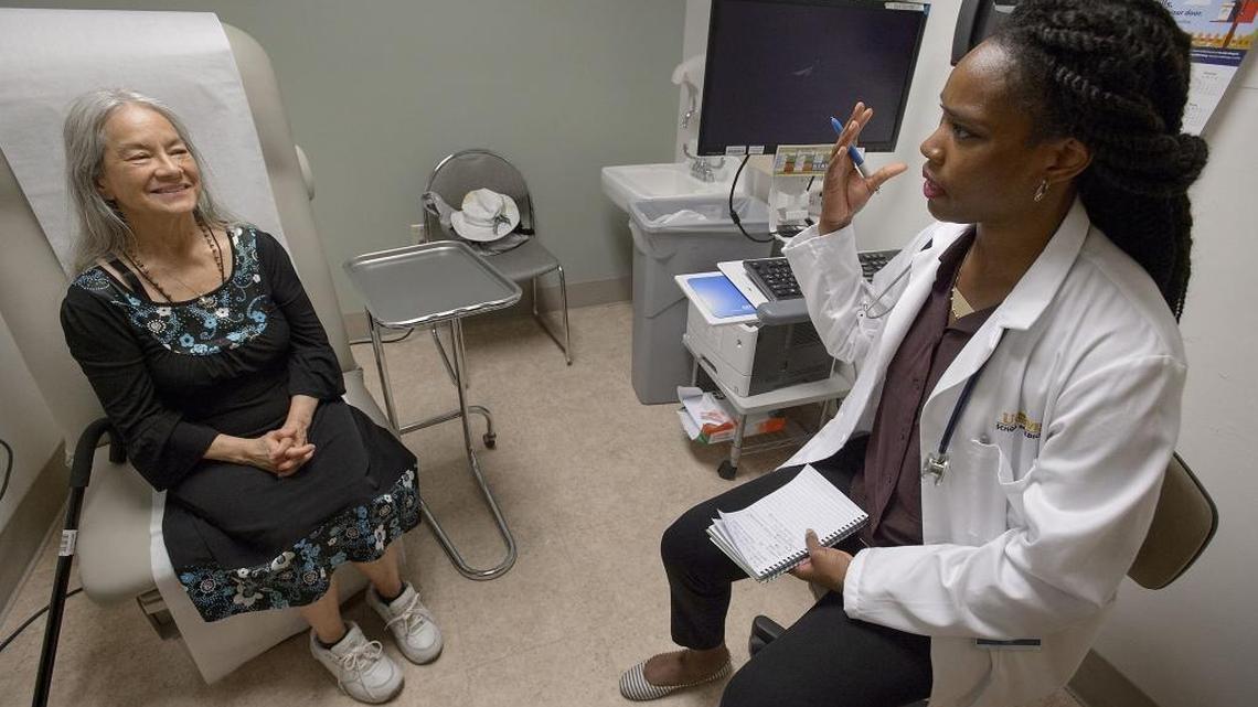 Patient Joyce Battaglia, left, is interviewed by first-year medical student Aljanee Whitaker at Kaiser Permenente South in Sacramento. A new UC Davis/Kaiser program gets students through medical school in just three years instead of four. The first class just graduated, and are beginning their residencies at local hospitals.