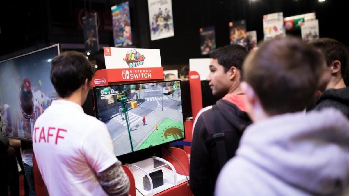 People play the Nintendo video game “Mario Odyssey” during the Paris Games Week in November. The World Health Organization will soon list gaming disorder as a health condition.