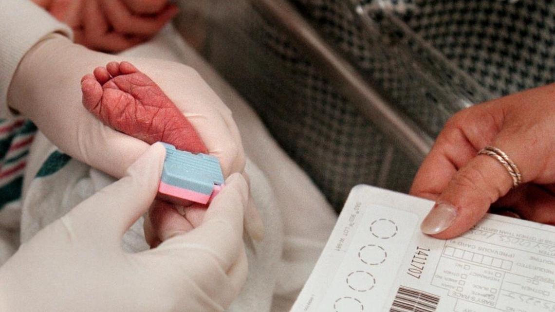 A baby at Holy Cross Hospital in Fort Lauderdale, Fla., gets his heel pricked for a host of genetic tests that can detect metabolic disorders.