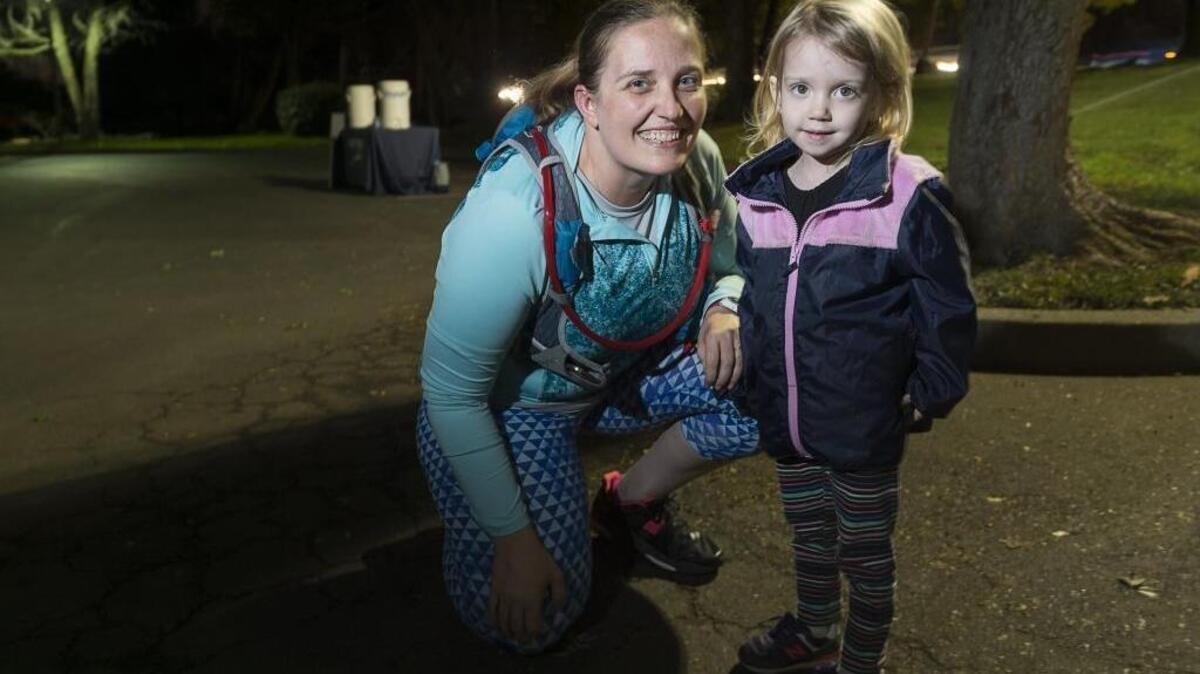 Faith Baker, 34, trains for the California International Marathon on Wednesday November 30, 2016 in Sacramento, Calif. Her daughter, Catarina, 3, is “my biggest cheerleader,” Baker says.