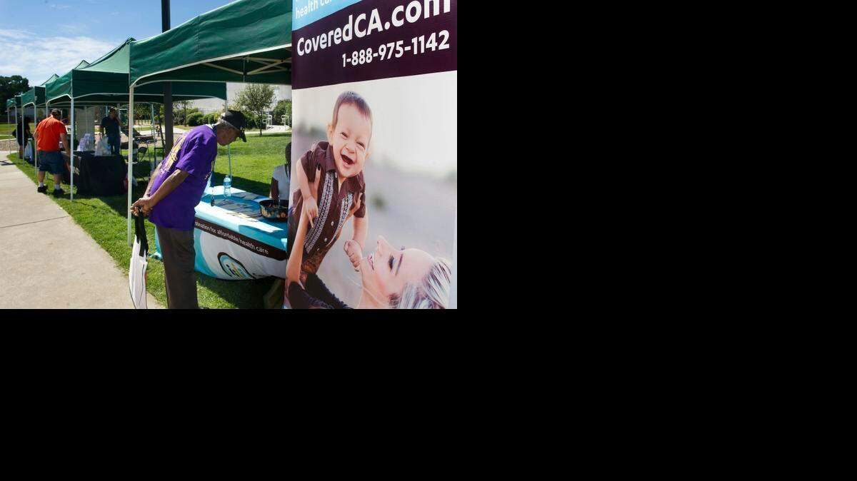 
Samuel Butler inquires at the Covered California booth during a neighborhood event in 2013.
