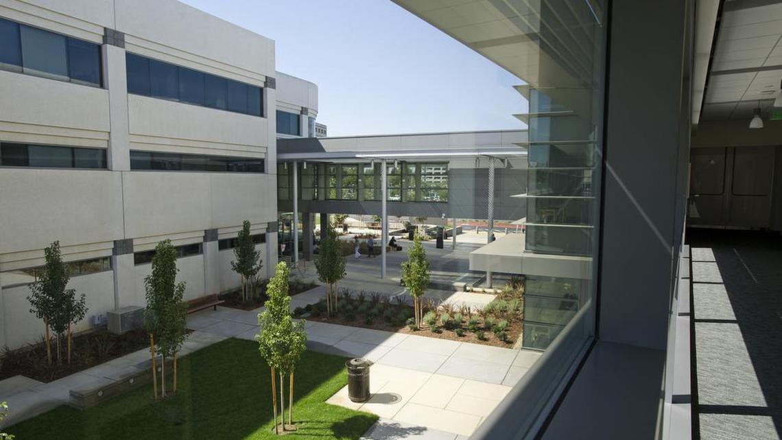 The older Cancer Center, left , is joined by a glass enclosed bridge connecting the new UC Davis Comprehensive Cancer Center on September 24, 2012 in Sacramento, Calif.