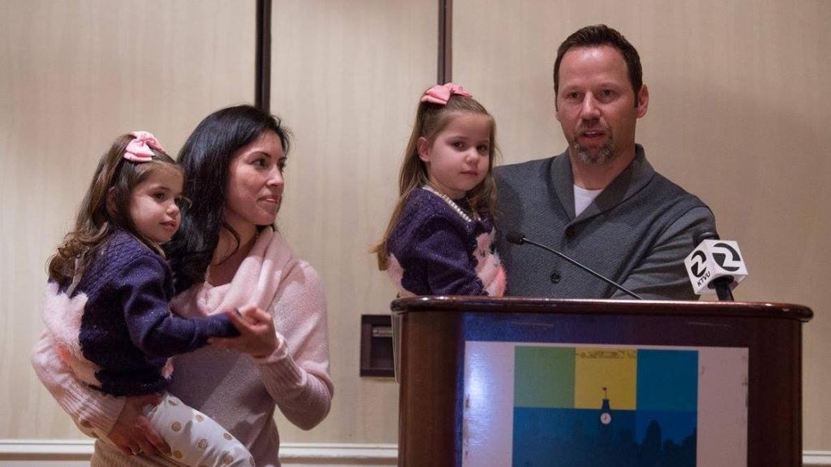 Evangelina Padilla-Vaccaro, left, with her parents and twin sister, Annabella, at a CIRM board meeting in December.