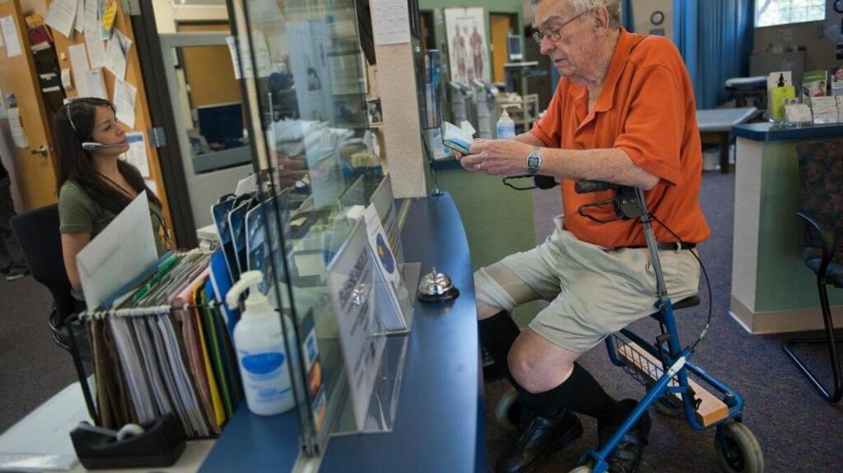 Neal Peek, 82, sits on his walker as he waits to make and appointment at Sutter Physical Therapy in Davis in this 2011 file photo. Peek injured himself during a fall.
