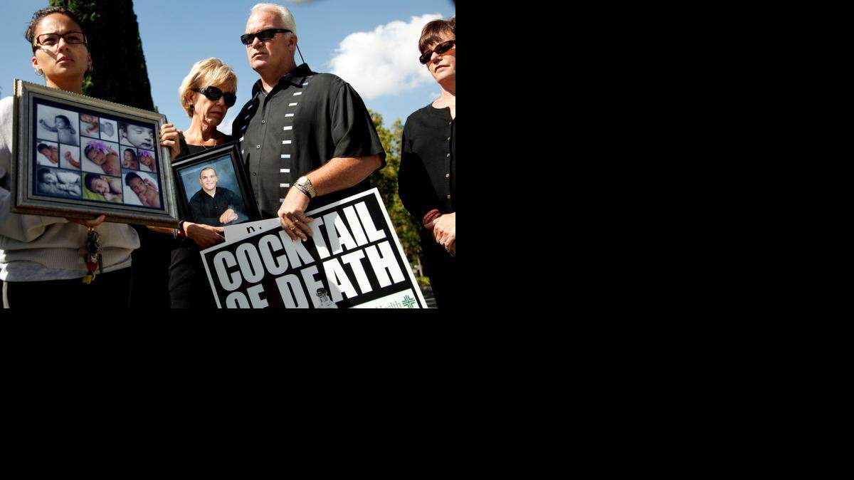 
Tammy and Tim Smick, center, join families of victims of drug abuse, physician overprescribing, and medical malpractice at a California Medical Association convention last year in Anaheim. 



