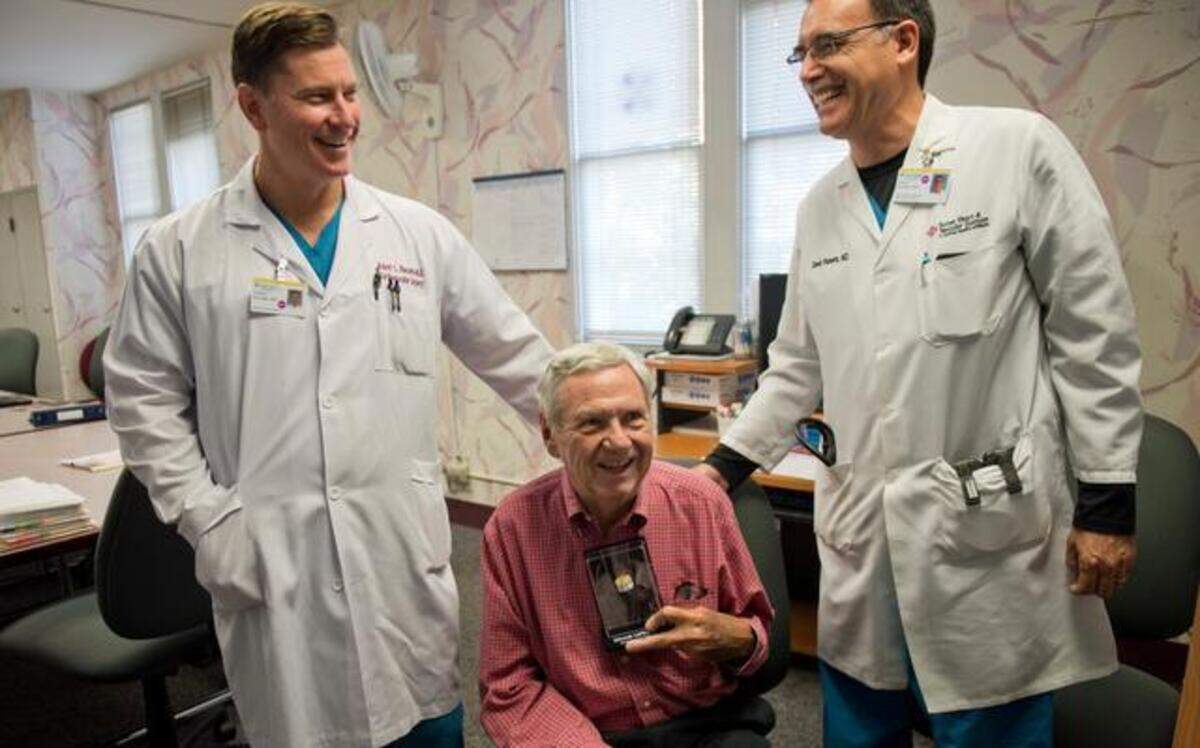 
Dr. Jim Affleck, 83, a retired OBGYN, center, holds a TAVR heart valve that has helped extend his life after heart surgeon Dr. Robert Kincade, MD, left, and interventional cardiologist Dr. David Roberts, MD, teamed up to implant the valve. Affleck delivered Kincaid 45 years ago. Affleck will be 84 years old on Halloween this Friday. They gathered at a press conference on Monday, Oct. 27, 2014 at Sutter Memorial Hospital in Sacramento, Calif.
