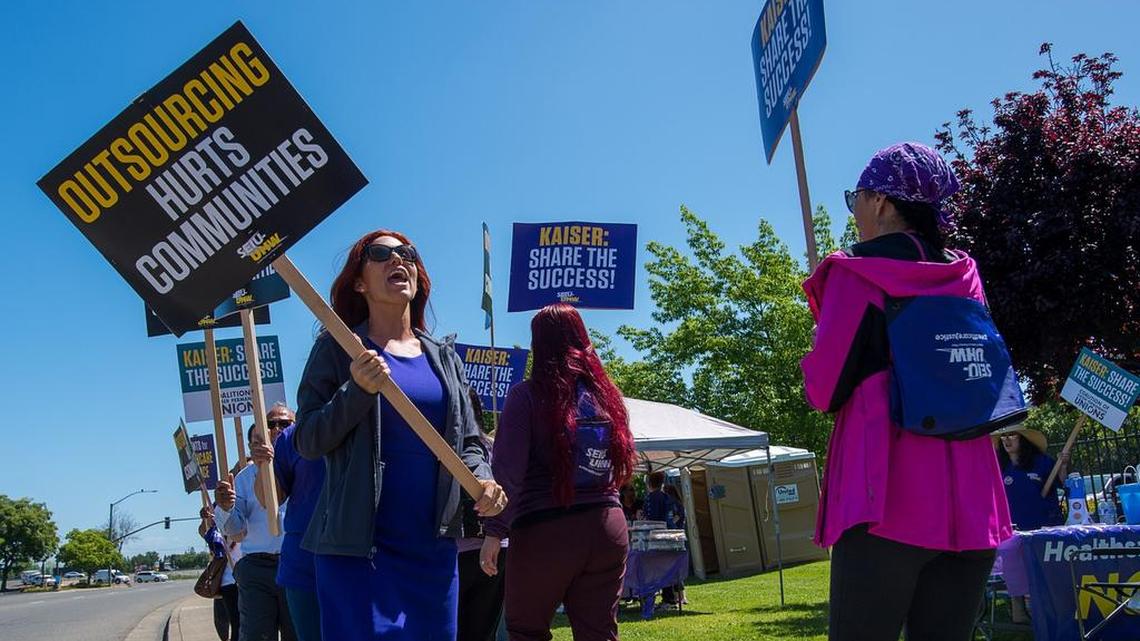 SEIU-UHW healthcare workers protest layoffs, relocations and wage proposals outside Kaiser Permanente on Wednesday May 2, 2018 in Sacramento, Calif. 
