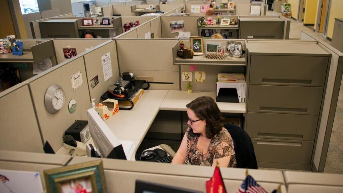 Charlotte Gibbs, an analyst with Sacramento-based Western Health Advantage, talks to a member on the phone.