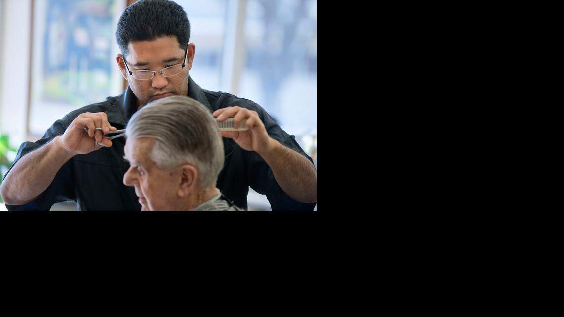 
Barber Chris Matsumoto cuts Louis Borovansky’s hair last month at Nakamura’s Barber Shop in Sacramento. Matsumoto, now 34, was only 26 when he had a stroke that left him temporarily unable to speak and in need of long months of therapy. According to the Centers for Disease Control, the chances of stroke have soared alarmingly among people in early adulthood and middle age
