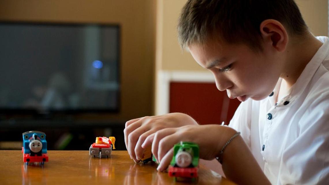 
Evan Justinich spends an afternoon playing with toy trains at home Wednesday in Elk Grove. The 10-year-old laser ablation surgery for epilepsy several months ago and went from suffering multiple seizures a day to none at all. In the past few years, Sutter Health has been a pioneering leader in laser ablation surgery for epilepsy. The minimally invasive surgery uses a long laser needle to zap the point in the brain at which seizures start. The entire procedure takes a fraction of the time of traditional brain surgery and patients generally go home the next day.
