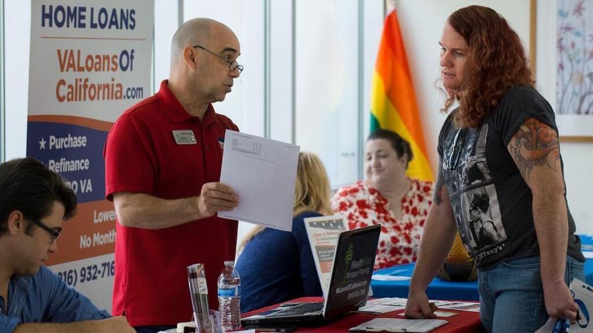 Andrew Vierra, left, speaks with Army veteran Sage Fox at the Sacramento VA medical Center in Rancho Cordova on Saturday, October 24, 2015. Sacramento's first LGBT Veterans fair took place at the center, providing vets with employment resources, mental health services and more. The event marks a major shift in VA care embracing LGBT vets, with more tailored care for LGBT vets following the repeal of Don't Ask Don't Tell.