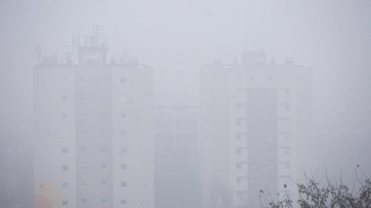 Smog shrouds dwelling houses in Budapest, Hungary, Monday, Jan. 23, 2017, when the level of air pollution reaches dangerous levels in the capital and large parts of the country. Budapest and several cities around the country issued smog alerts due to the high concentration of airborne dust particles.