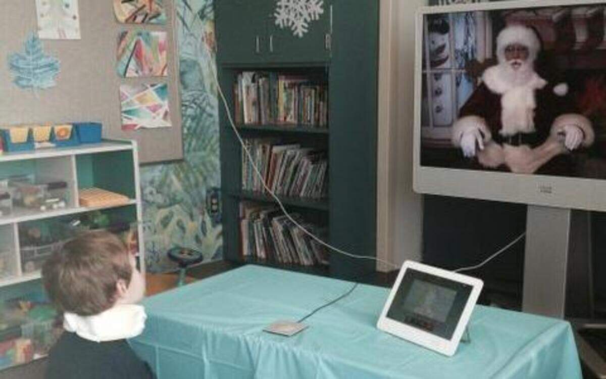 
Lucas Schager, 5, talks to Santa via Web connection in the UC Davis Children’s Hospital playroom Tuesday. The program allows some children who cannot leave their rooms to call in to Santa via iPad. 
