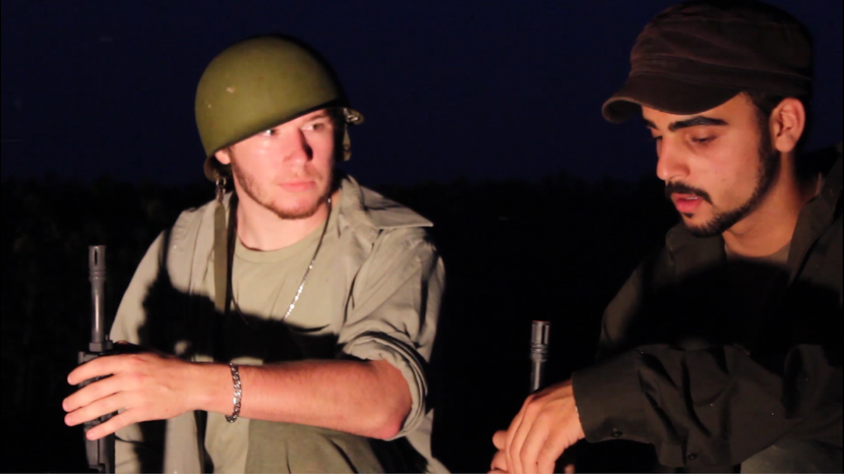 
Davis Senior High senior Gabriel McKinney and Da Vinci senior Christopher Monheit plan an undercover rescue mission in a scene from “Unforgotten.”
