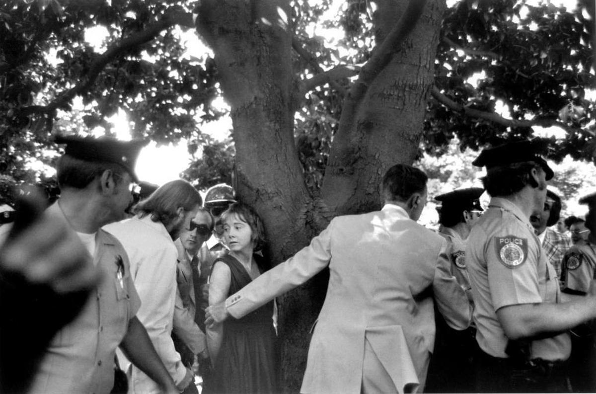 Sacramento Police and Secret Service men handcuff Lynette “Squeaky” Fromme under a Capitol Park tree after she tried to shoot President Gerald Ford on Sept. 5, 1975.