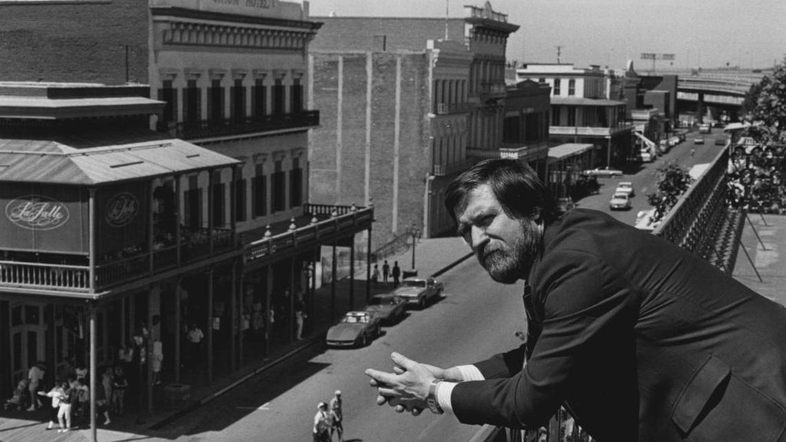 Historian Jim Henley surveys Old Sacramento from a balcony on Second Street.