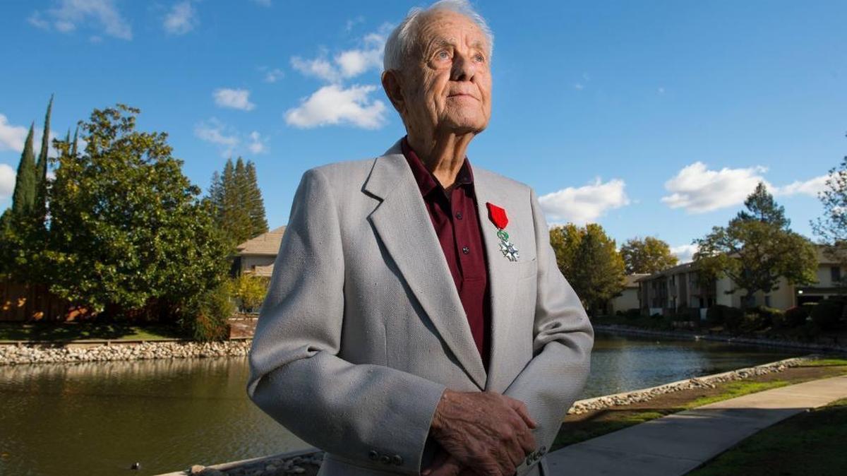 Edwin “Gene” McDonald, 91, stands proudly wearing France’s highest award, the Legion of Honor, pinned on his coat lapel on Tuesday, Nov. 10, 2015, in Sacramento. Last month, the French Consulate in San Francisco presented McDonald and three other WWII veterans with medals. McDonald flew 67 missions in France, Belgium and Germany as the pilot of a P-47 fighter plane.