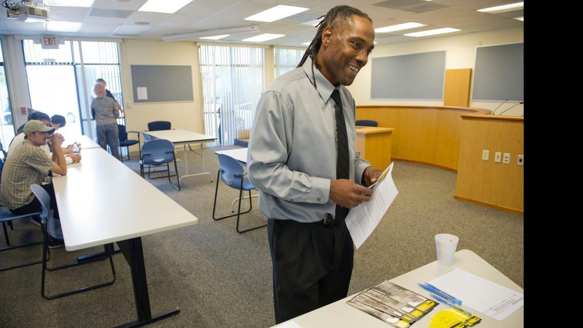 
Maurice Tramble talks with a truck driving company during a job fair at Highlands Community Charter School, May 20, 2015. He hopes to find a company tol hire him after he completes his high school diploma and earns his Class A license.
