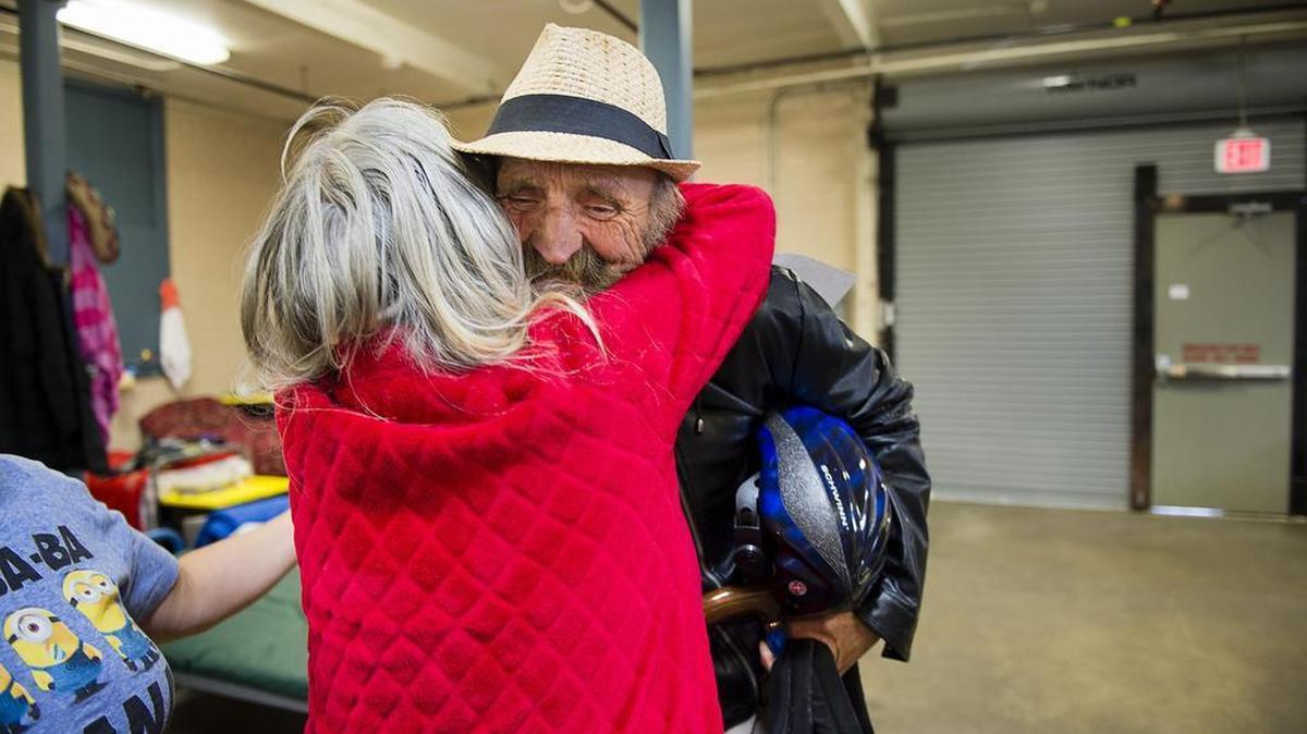 Egbert “Skip” Visker is hugged by resident as he leaves the homeless shelter in Placer County to a new home in Auburn on Wednesday. The formerly homeless man is moving into a home purchased with money from the Whole Person Care grant.