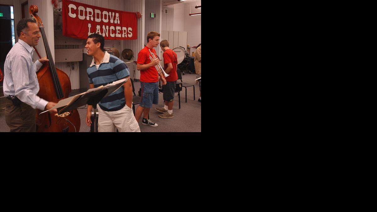 
Cordova High School band drummer Rocky Burris chats with 1977 graduate Lester Holt, left, of NBC News during band rehearsal in May 2004. Holt visited Cordova as part of a “Today Show” segment in which reporters visited their high schools.
