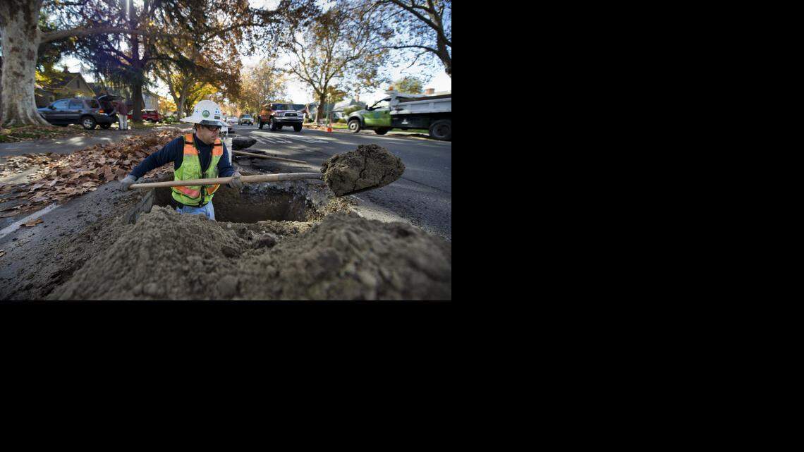 
A worker with Teichert Construction digs a hole on Land Park Drive south of Second Avenue as part of  Sacramento’s  water main replacement project in Land Park on  Nov. 24. Sacramento holds the largest body of unmetered water connections in the state.
