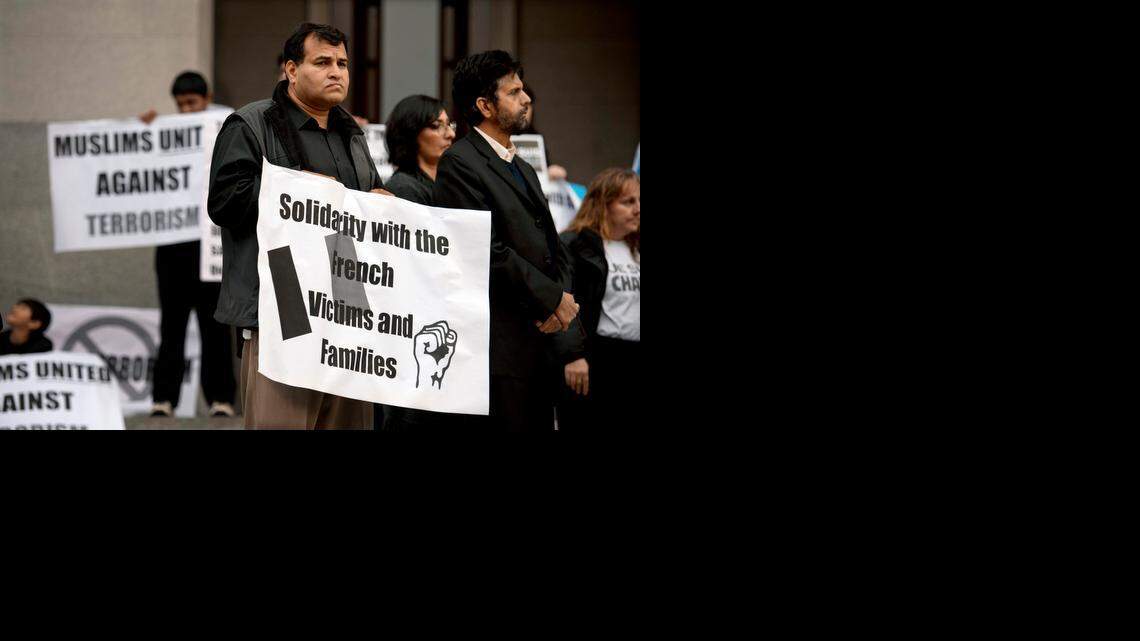 
Sacramento Muslims from throughout the region, including Javaid Iqbal, center, of American Muslim Voice Foundation, hold a peace rally on the west steps of the state Capitol on Friday. “We condemn the atrocities,” said one speaker at the event.
