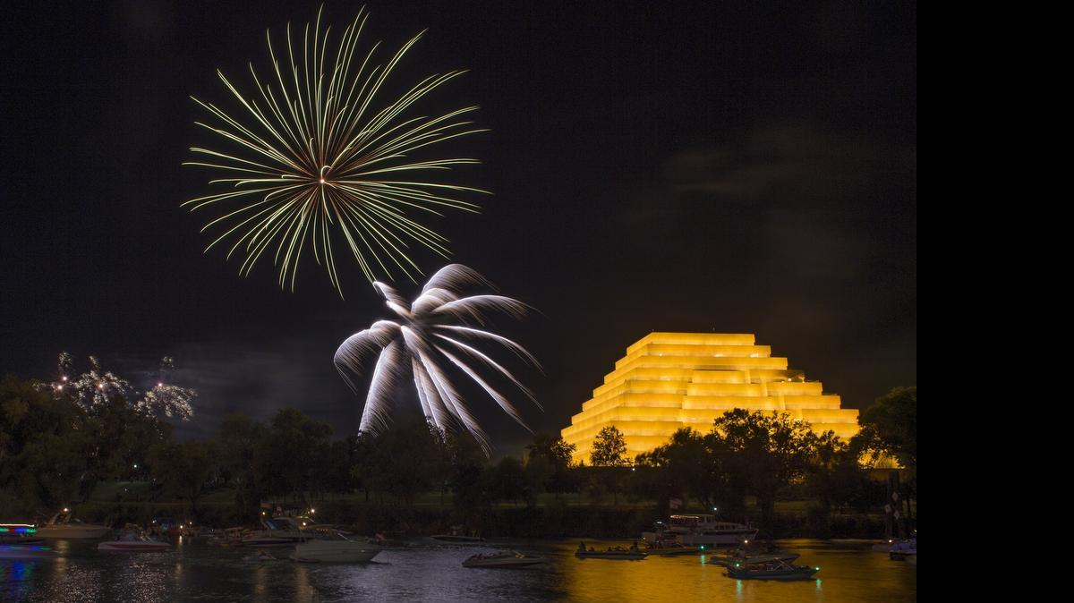 
Boats in the Sacramento River watch fireworks illuminate the sky in West Sacramento Friday evening following the River Cats and the Salt Lake City Bees game at Raley Field.
