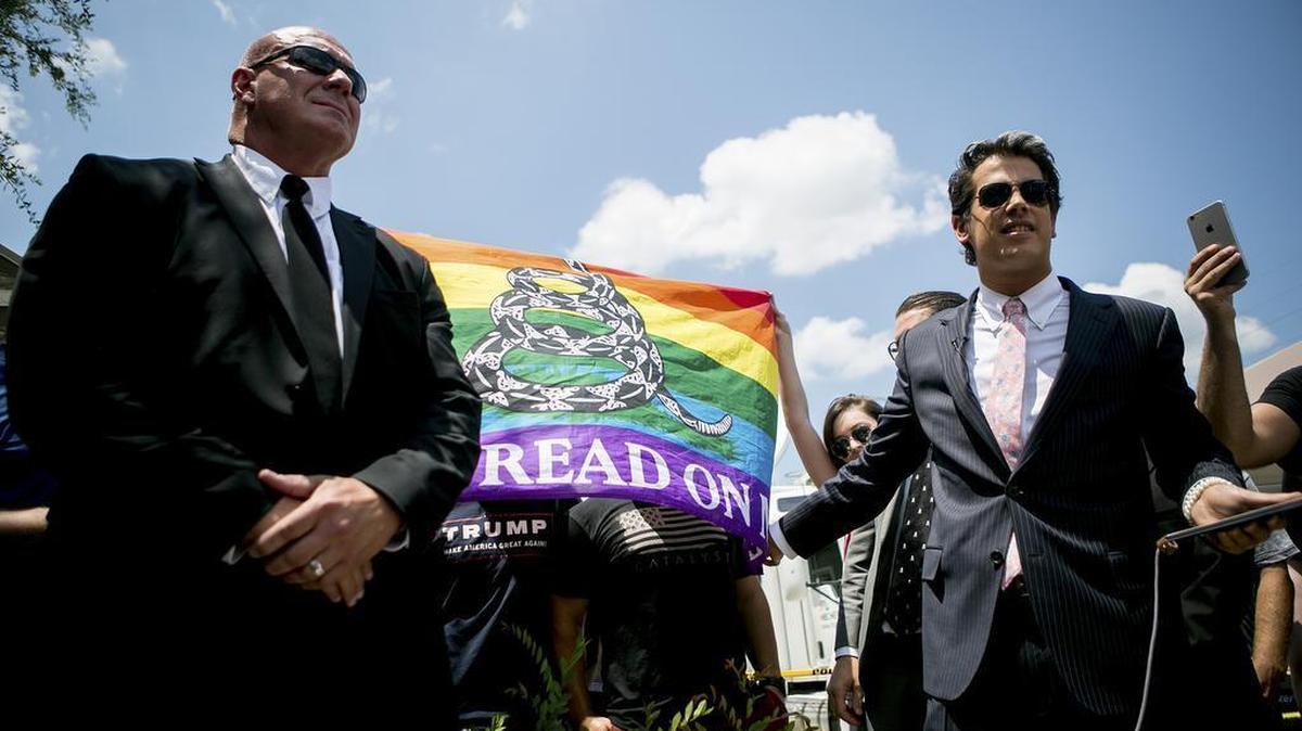 Milo Yiannopoulos, right, near the site of the Pulse nightclub shooting in Orlando, Fla., June 15, 2016.