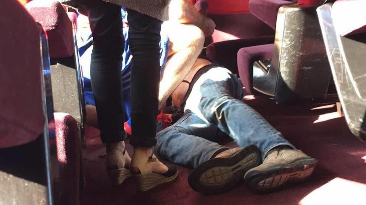 
In this photo provided by Christina Cathleen Coons, a person lies on the floor after an incident on a high-speed train traveling from Amsterdam to Paris on Friday, Aug. 21, 2015. A gunman opened fire on the train wounding several people before American passengers subdued him.
