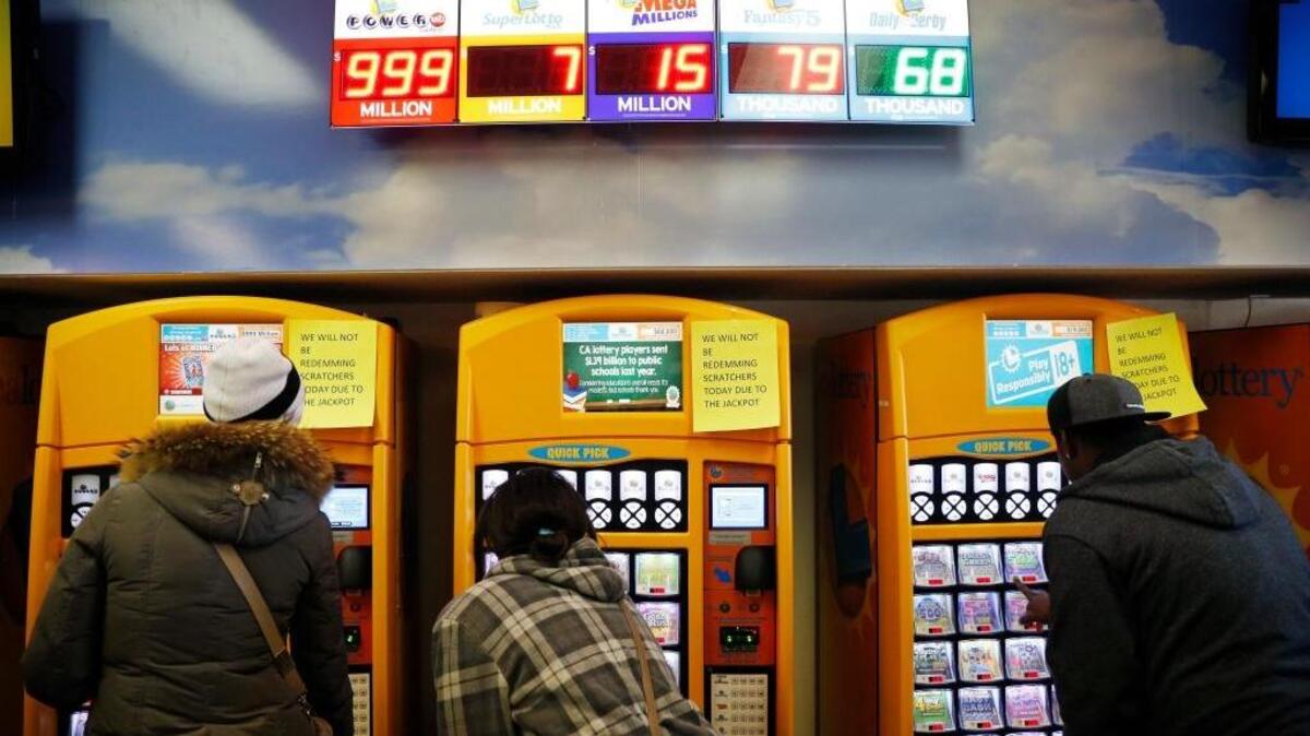 In this Jan. 12, 2016, file photo, people buy lottery tickets at the Primm Valley Casino Resorts Lotto Store just inside the California border near Primm, Nev. For the first time in CA Lottery history, the Powerball and Mega millions jackpots eclipsed $300 million at the same time.
