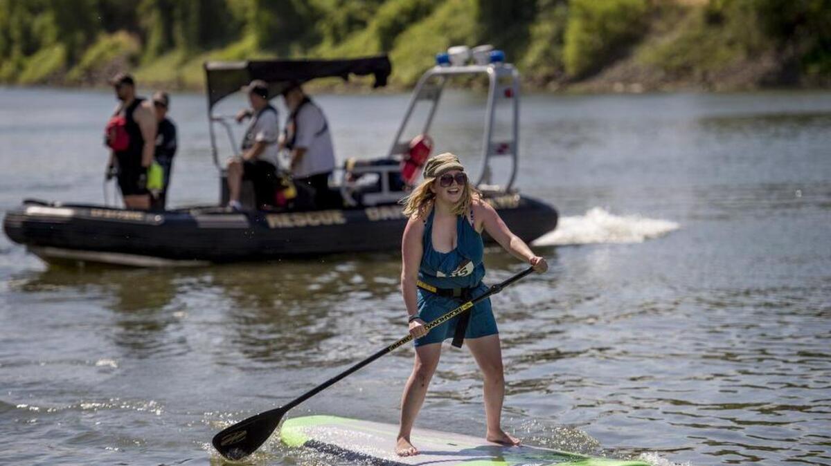 Paddle border Dana Thompson competes in the solo race portion of the 2nd annual Paddle 4 DART fundraising event at Crawdads on the River at the Riverbank Marina on Saturday, June 11, 2016, in Sacramento.