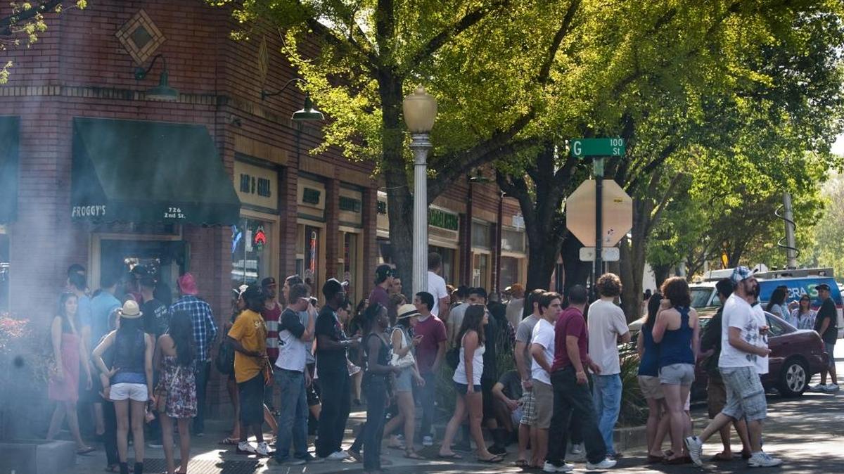 Crowds attend an event in downtown Davis in 2011. A recent Davis city survey found that panhandling was a top concern for downtown business owners and residents in the college town.