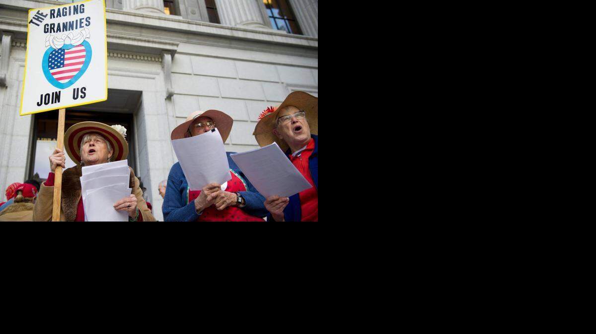 
Three members of the Sacramento area chapter of The Raging Grannies – Joan Kelly, left, Dorothy Orolin and Billie Hamilton – sing a song about human rights at a recent homeless rally.
