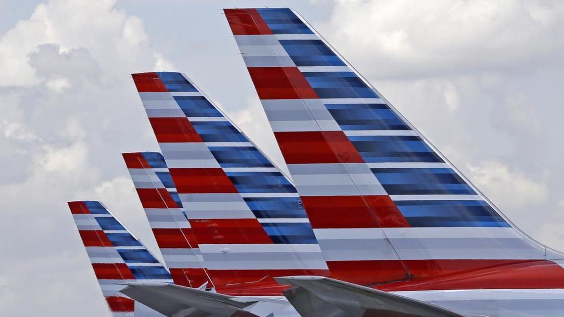 This photo July 17, 2015, photo shows the tails of four American Airlines passenger planes parked at Miami International Airport, in Miami.