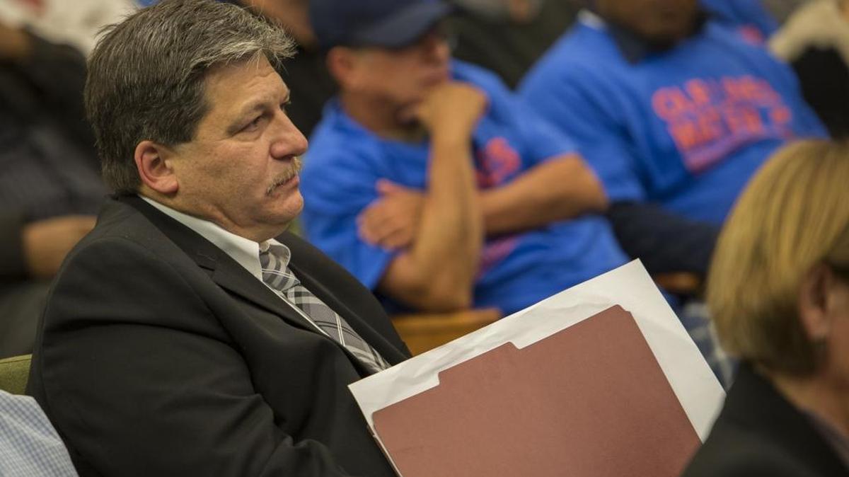 Developer Paul Petrovich attends a City Council hearing.