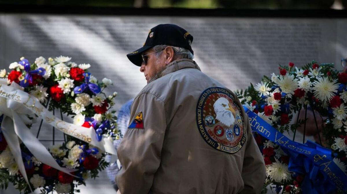 Vietnam War veteran Frank Smart of the 1st Calvary Division Air Mobile stands at The Global War on Terror Wall of Remembrance display at the State Capitol Park on Monday, Nov. 10, 2014 in Sacramento, Calif. Smart served in the Vietnam War from 1968-1969 as a soldier and as a journalist, writing and photographing stories from the front lines.