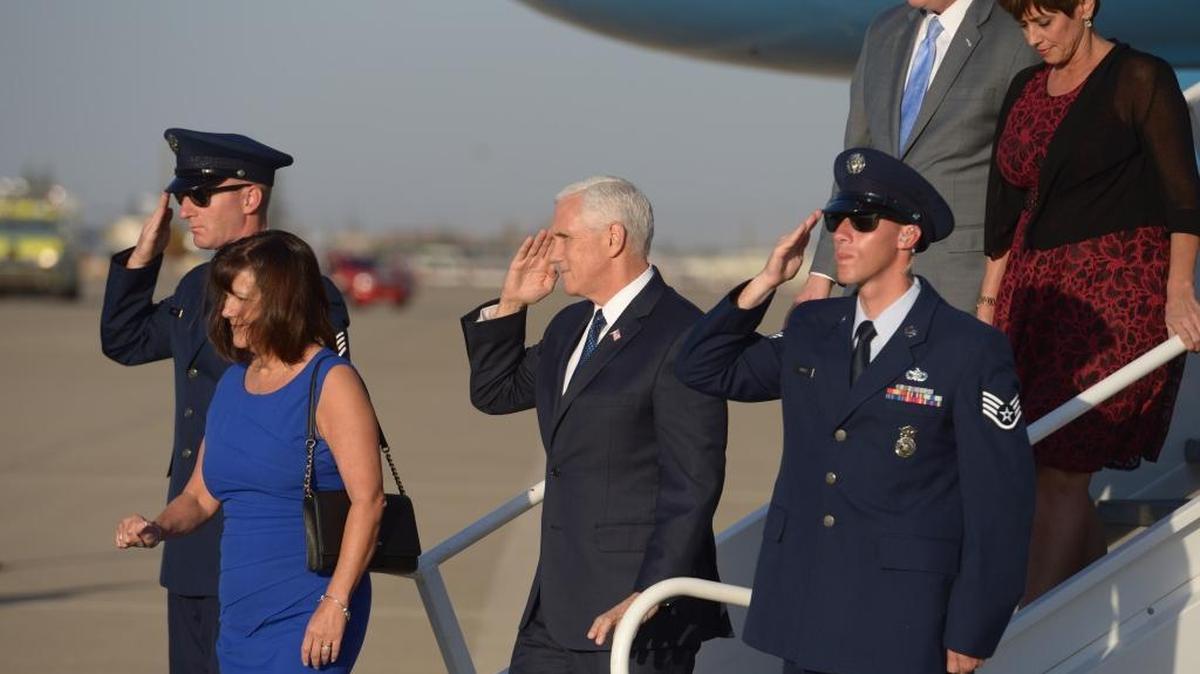 Vice President Mike Pence salutes upon his arrival at Mather Airport. Pence attended a tax relief event in Rancho Cordova and was accompanied by his wife, Karen, Congressman Kevin McCarthy and his wife Judy.