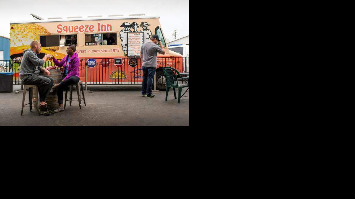 
A new ordinance going to the Sacramento City Council would make it simpler for food trucks to operate on private property and extend the time they could park on public streets. This truck was serving people at Track 7 in Curtis Park on Tuesday.
