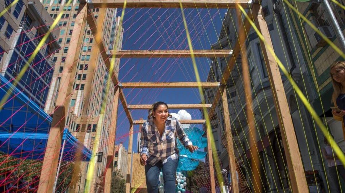 Judith Salazar explores “Chroma City” during Sacramento United Park(ing) Day on Friday, Sept. 16, 2016. Metered parking spots on Ninth Street near J and K streets were transformed into a series of temporary “parklets,” designed to encourage play in the urban environment.