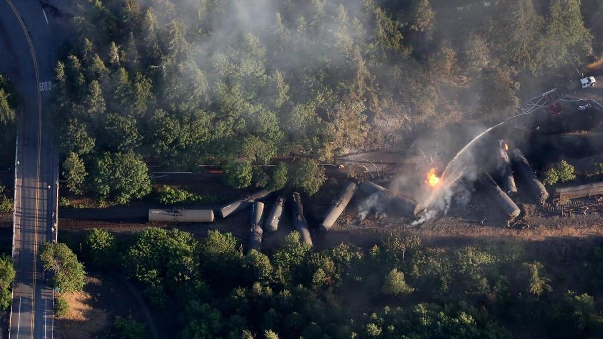 A Union Pacific oil train burns near the town of Mosier, Ore., after derailing last June. The Oregon Department of Environmental Quality later found oil-contaminated groundwater.