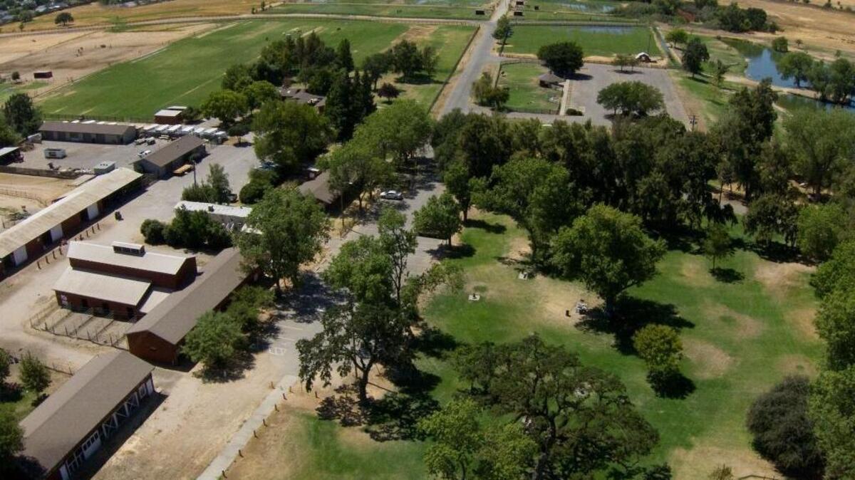 Aerial view from 2010 of the Gibson Ranch Equestrian Center, at left, and Gibson Lake, far right, at Gibson Ranch in Elverta. The Board of Supervisors will consider proposals Tuesday to keep the park open.