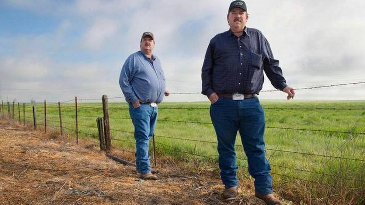 Andrew Watkins, right, and brother, Kenny Watkins, at the family farm in Linden in March 2015.
