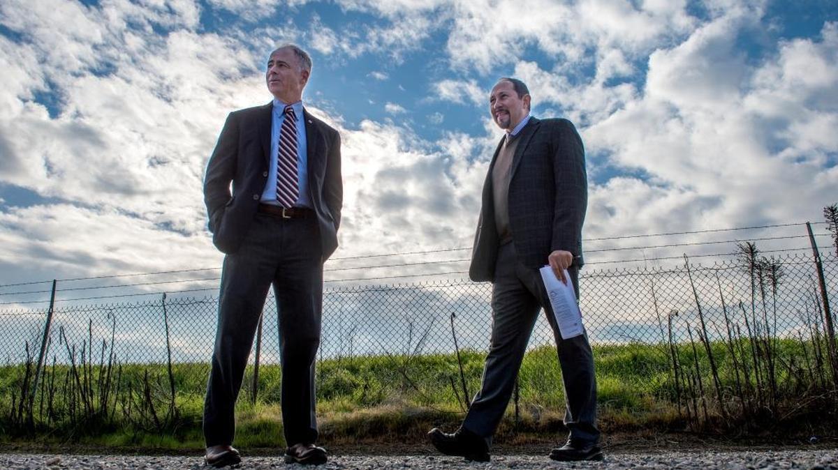 Parks director Chris Conlin and senior parks planner Raymond Costantino walk on a trail at Sutter’s Landing Regional Park on Wednesday, November 30, 2016 in Sacramento, Calif. The trail is set to become a paved path that someday will run all the way to Sacramento State.